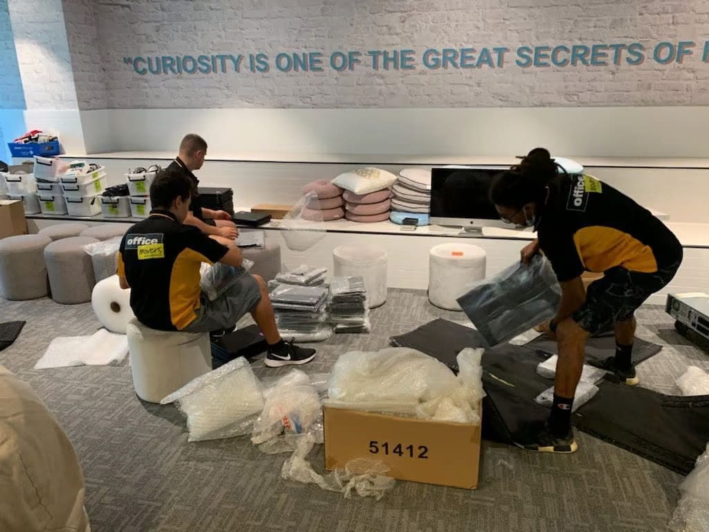 Packing laptops for office relocation in Sydney and Melbourne.